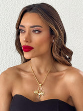 Carregar imagem no visualizador da galeria, https://febijus.bwimg.com.br/febijus/produtos/colar-folheado-a-ouro-18k-pingentes-de-conchas-e-tartarugas-1760988238.3476.jpg