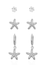 Carregar imagem no visualizador da galeria, https://febijus.bwimg.com.br/febijus/produtos/trio-de-brinco-folheado-a-ouro-18k-e-prata-design-estrela-do-mar-cravejado-1766779997.8933.jpg