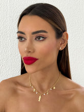 Carregar imagem no visualizador da galeria, https://febijus.bwimg.com.br/febijus/produtos/choker-folheado-a-ouro-18k-peixes-com-buzios-e-cristais-1766163694.3416.jpg
