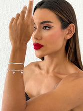 Carregar imagem no visualizador da galeria, https://febijus.bwimg.com.br/febijus/produtos/pulseira-folheada-a-prata-925-duplo-coracoes-vazado-e-cristal-1768411148.2028.jpg
