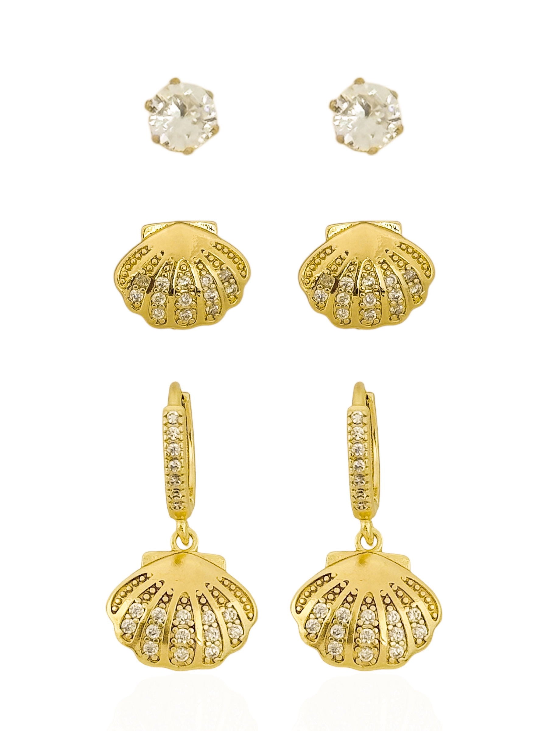 https://febijus.bwimg.com.br/febijus/produtos/trio-de-brinco-folheado-a-ouro-18k-e-prata-design-concha-cravejada-1766780466.5328.jpg
